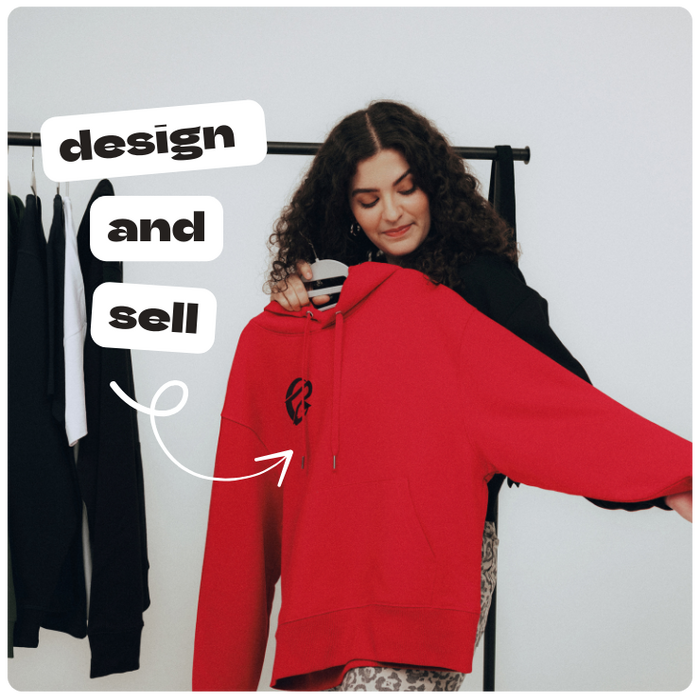 creator holding hoodie